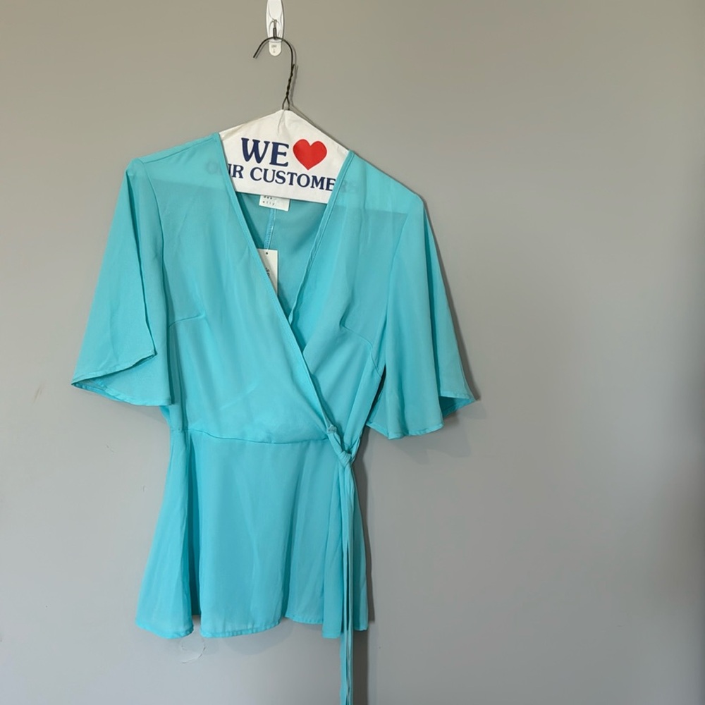 Bright blue Francesca’s sheer blouse bow tie waist